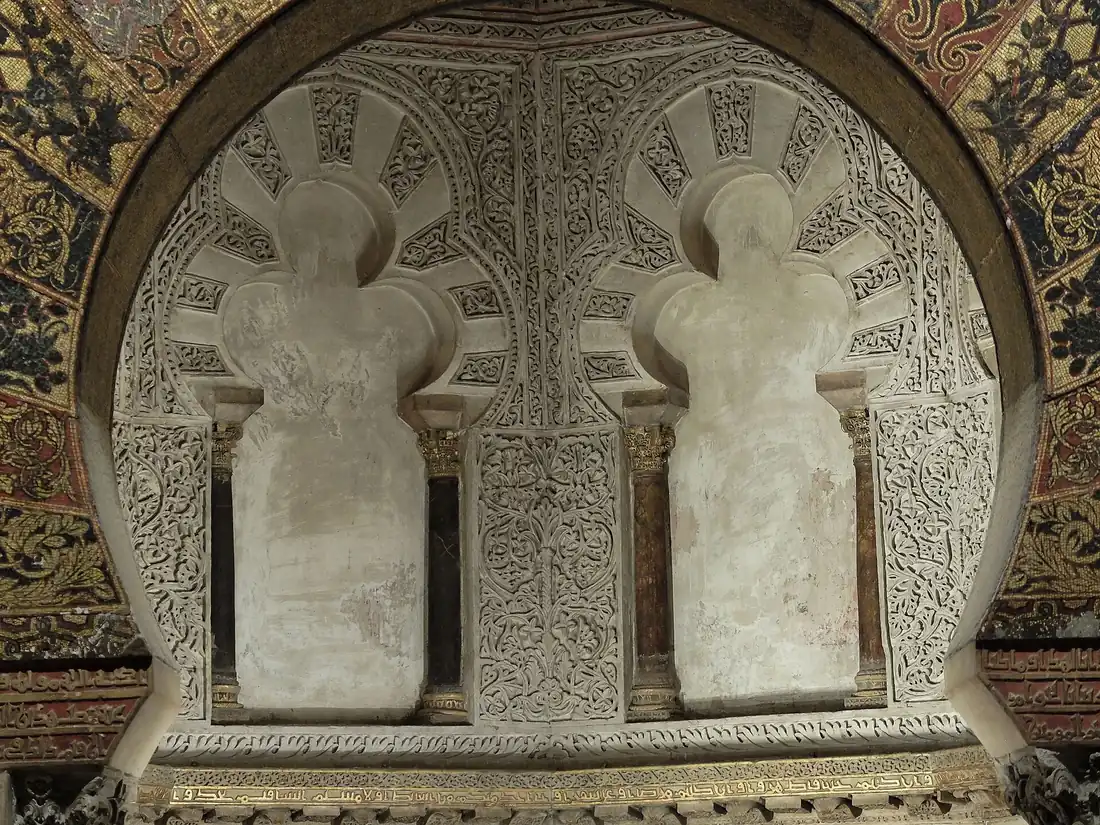 The golden mosaic mihrab prayer niche glowing under a scallop dome on a mosque cathedral of cordoba tour in Cordoba, Spain