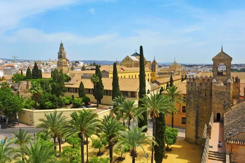 Fountains and clipped hedges in the Alcázar gardens on a mosque cathedral of cordoba and alcazar tour in Córdoba, Spain