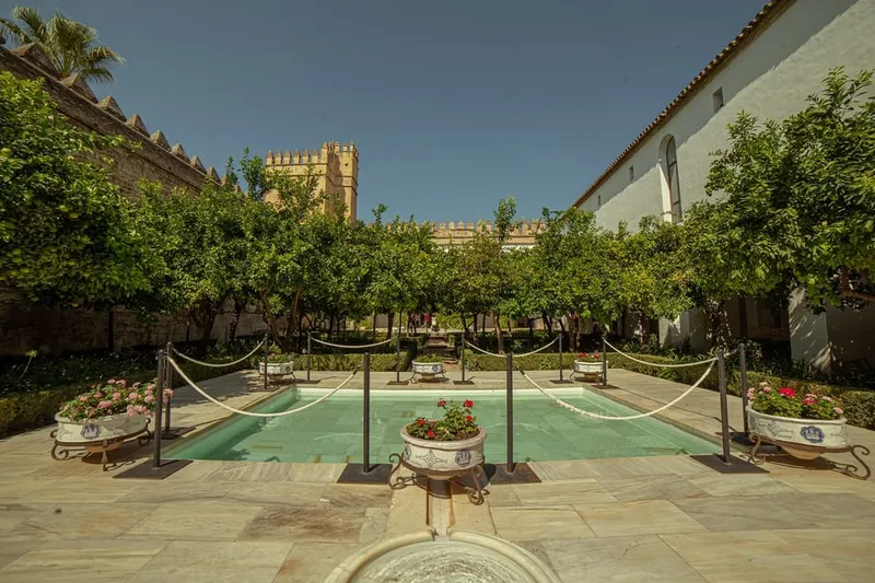 The Alcázar tower above terraced gardens on a mosque cathedral of cordoba and alcazar tour in Córdoba, Spain