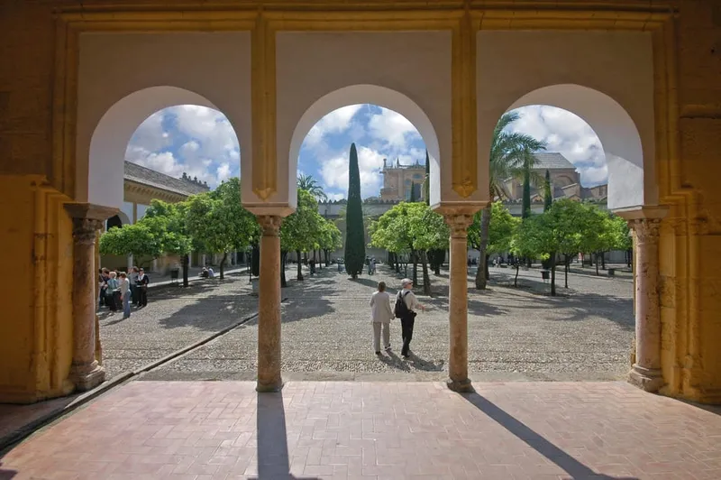 The flower-filled Calleja de las Flores framing the bell tower on a mosque cathedral of cordoba and jewish quarter tour in Córdoba, Spain